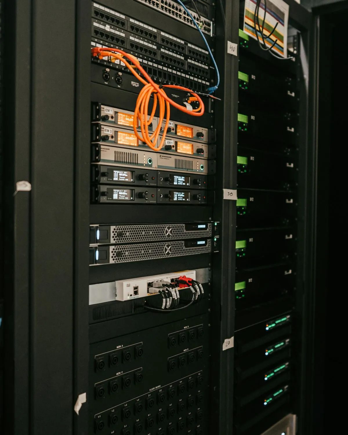 A rack of servers with network cables